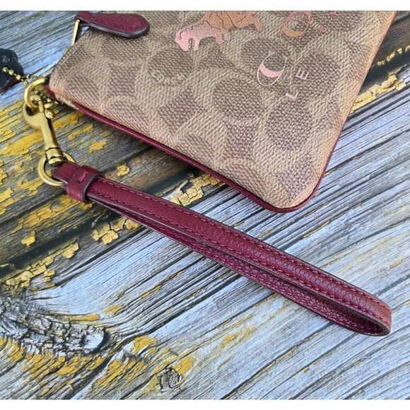 Coach Signature Canvas w/ Rexy and Carriage Motif Small Zip Wristlet. #88771 - Picture 5 of 7